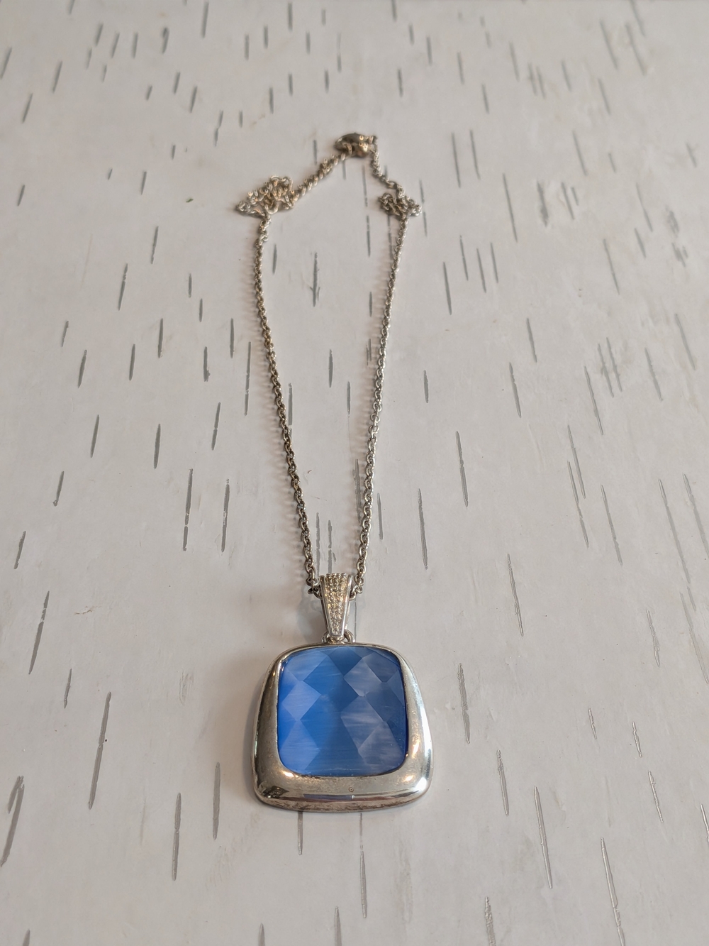 Silver Pendant Necklace with Faceted Blue Stone